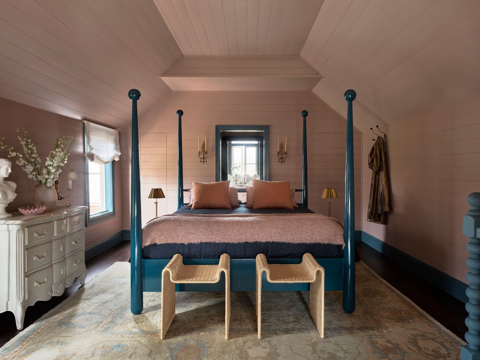A Homestead bedroom with a blue four-poster bed and a white dresser